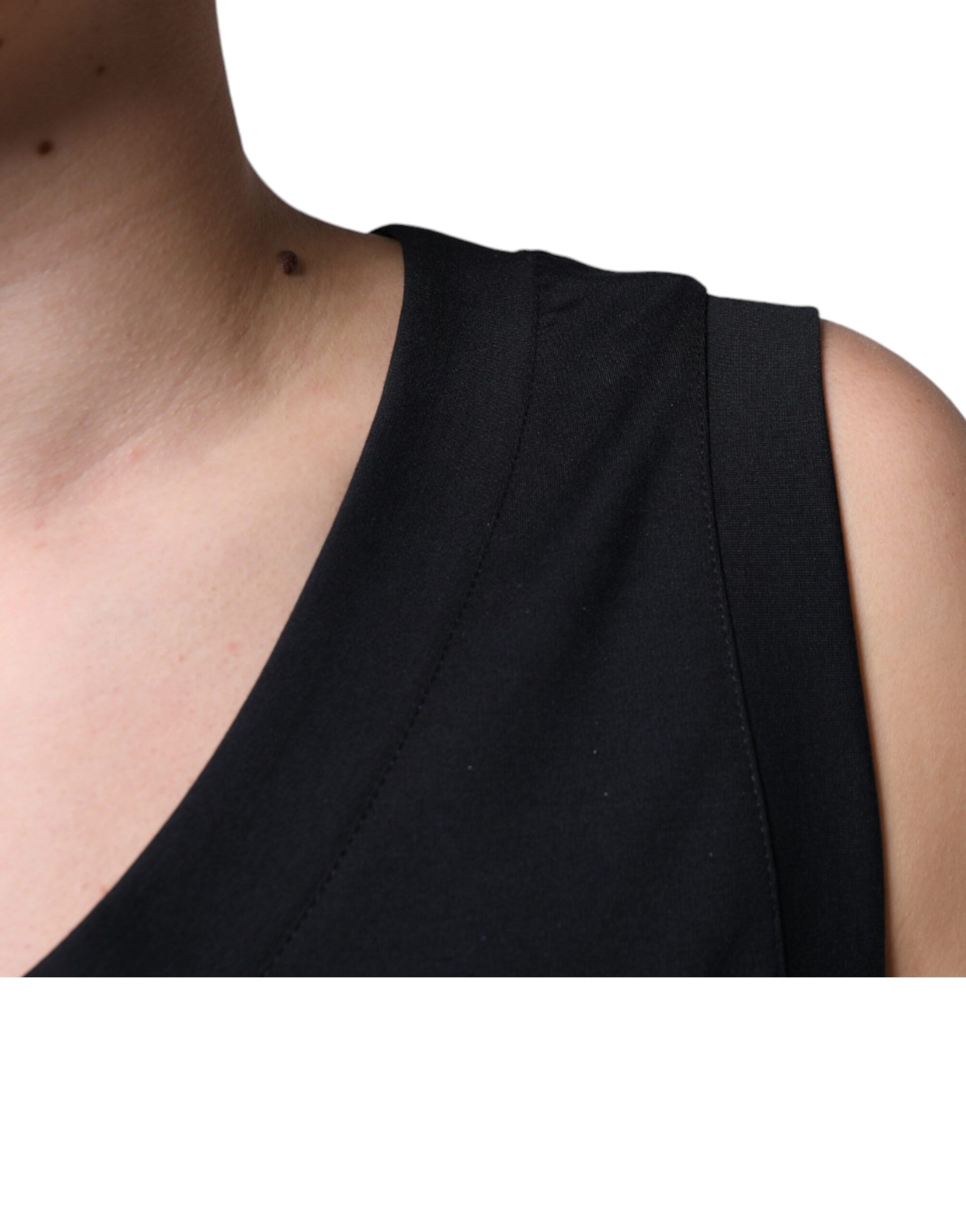 Black tank top on person's shoulder