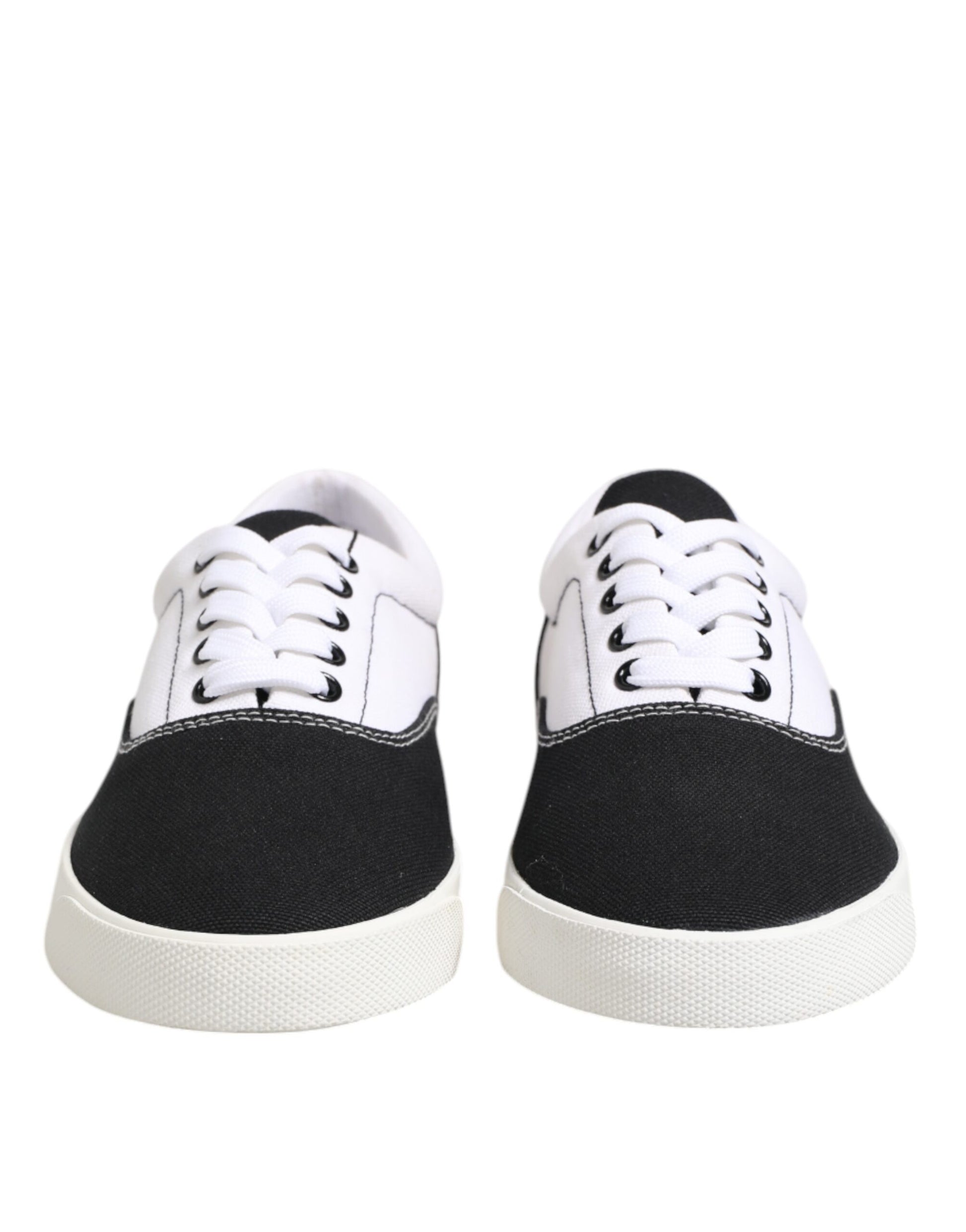 Pair of black and white sneakers with laces