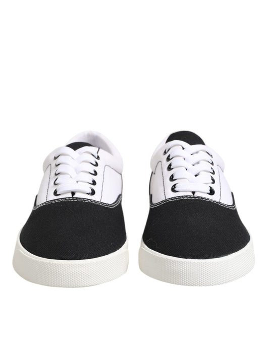 Pair of black and white sneakers with laces