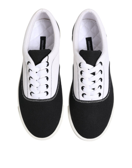 Pair of black and white sneakers with laces