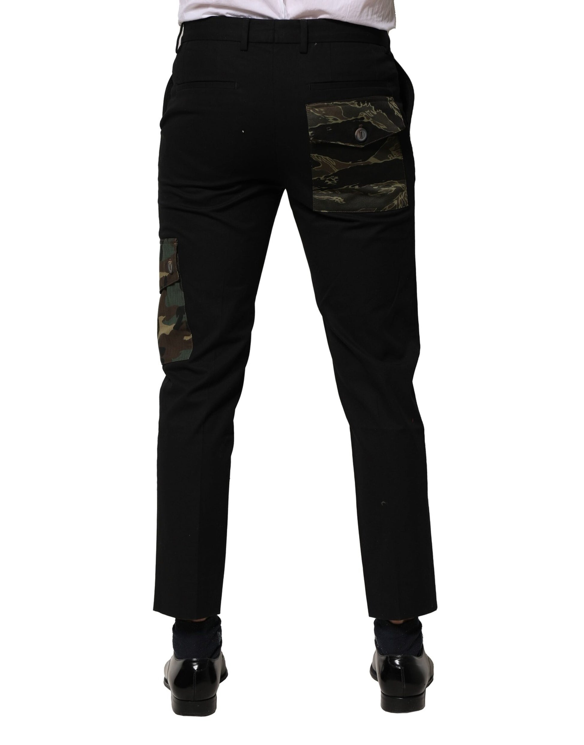 A pair of black cargo pants with camouflage pockets and a zippered front pocket