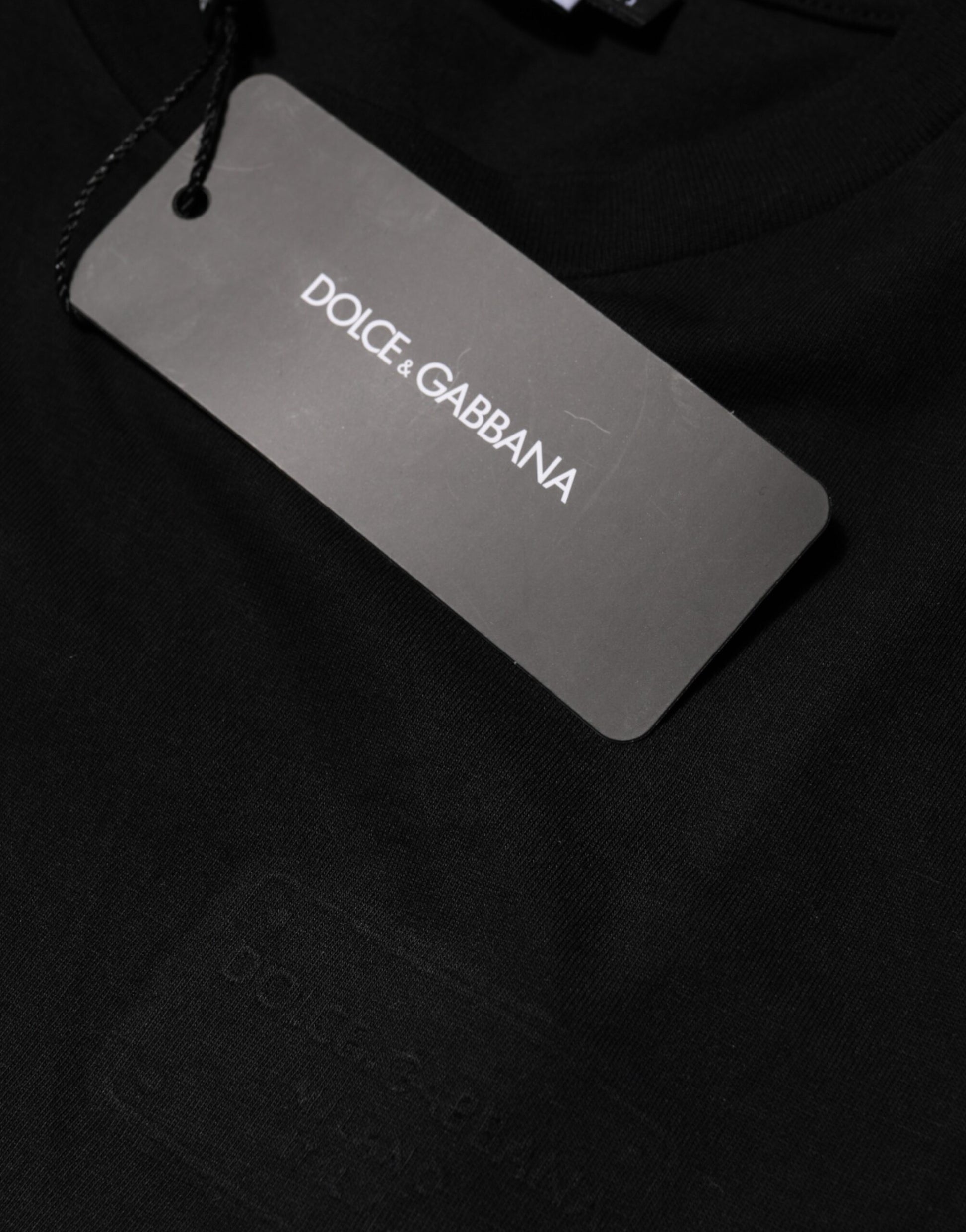 Black t-shirt with a tag on it
