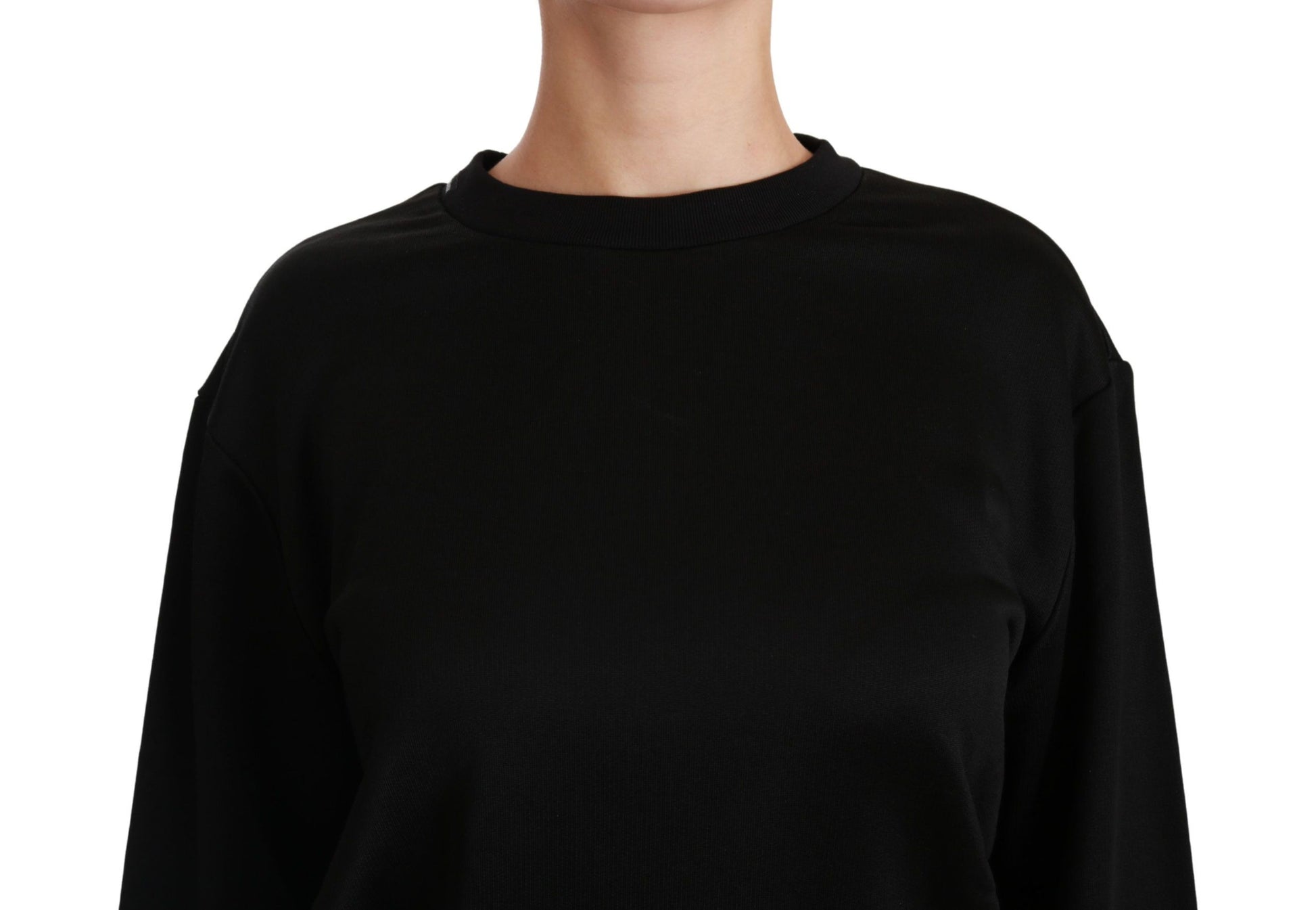 Long sleeved black sweater on a mannequin