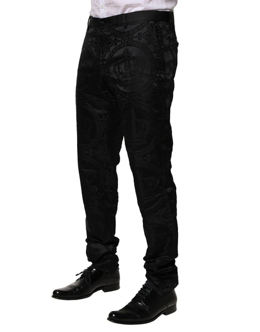 A pair of black cotton dress pants with a patterned design on the legs