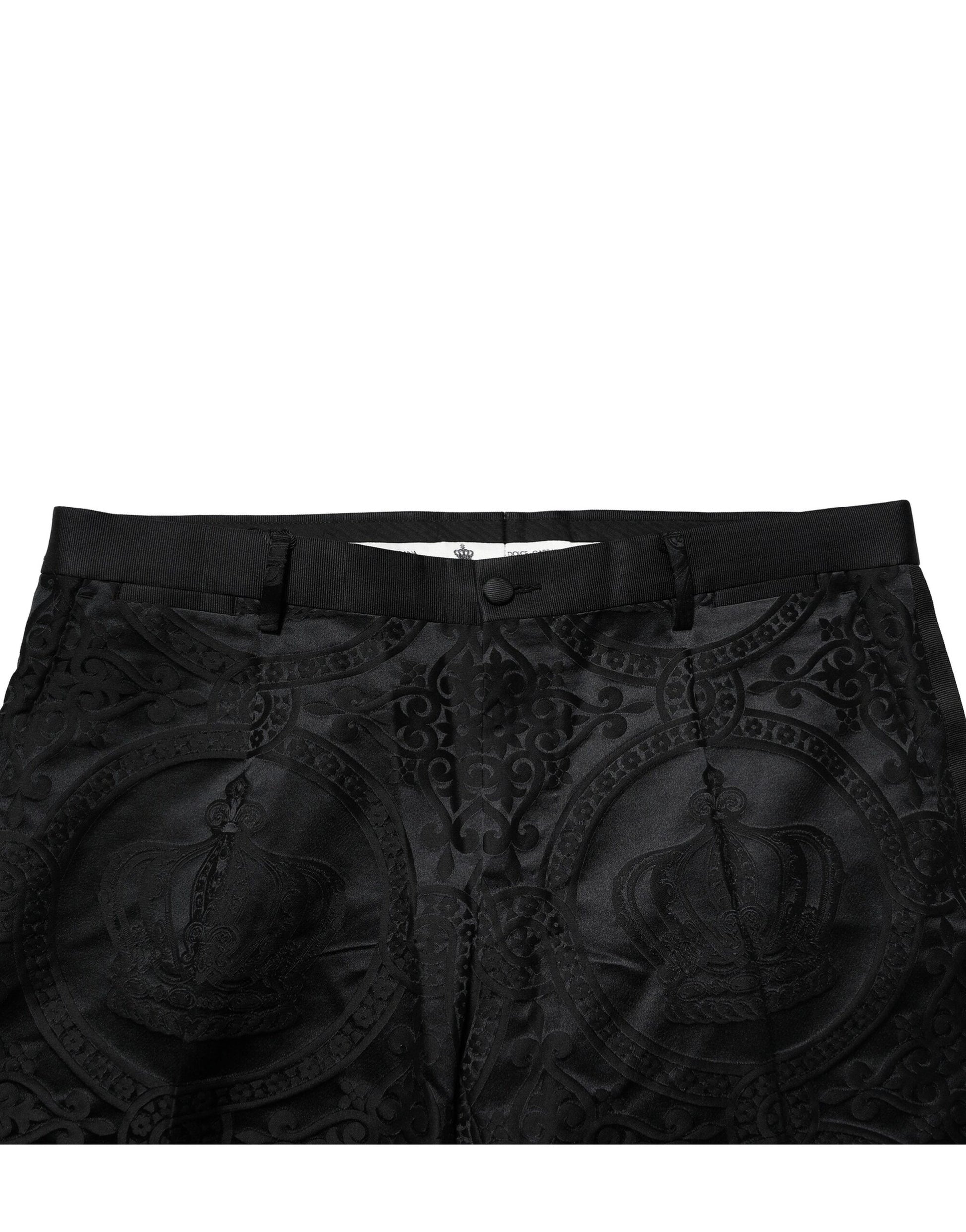 A pair of black cotton dress pants with a crown design on the waistband