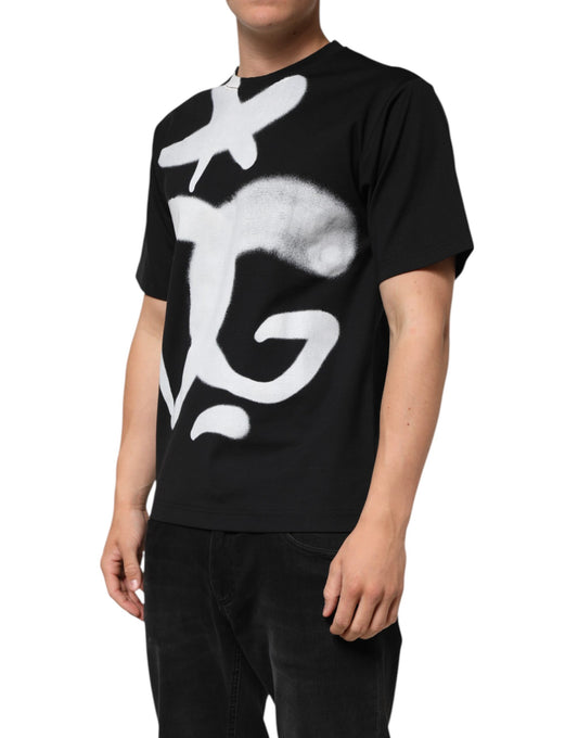 Man wearing black t-shirt with white design on front