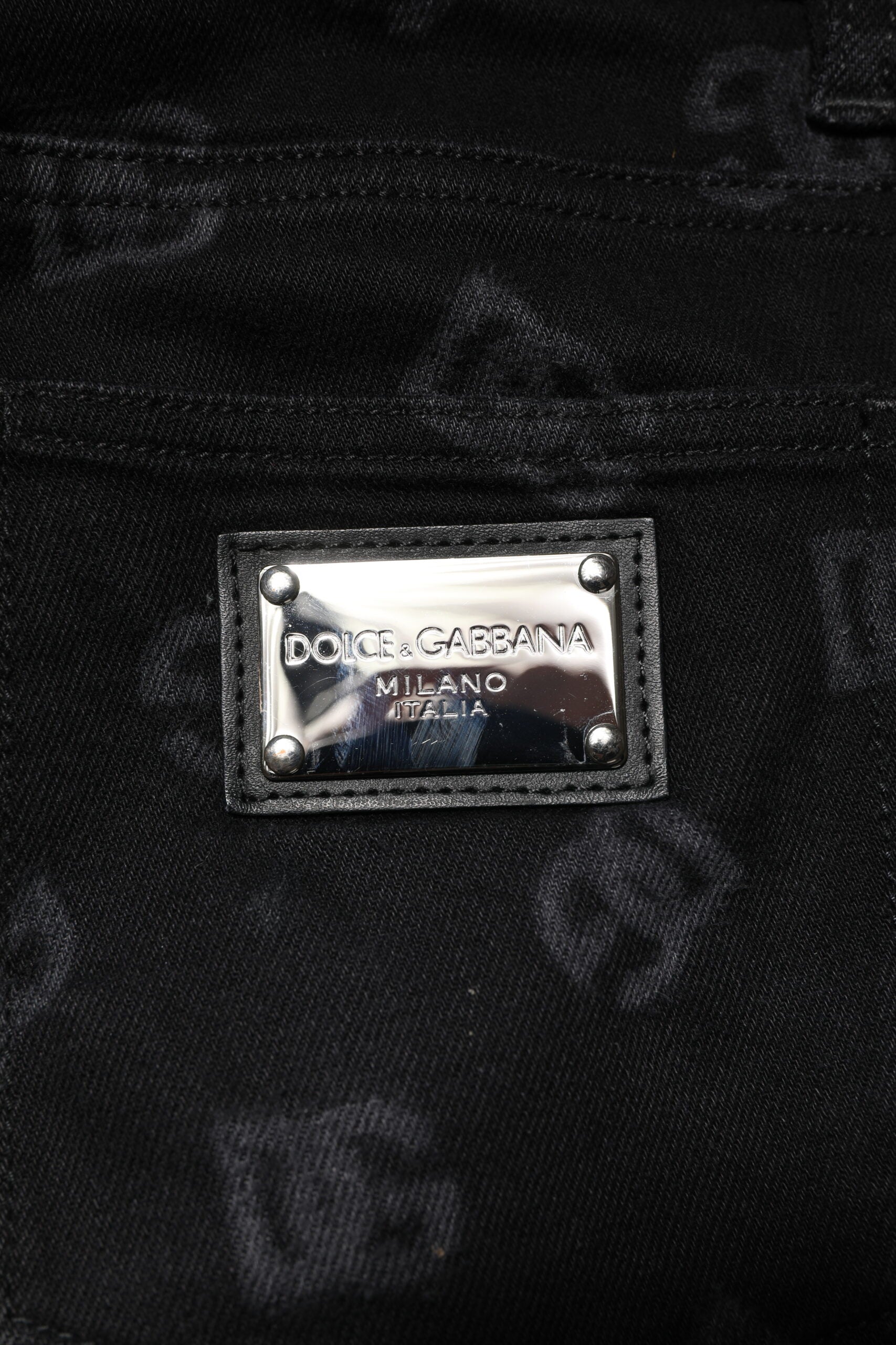 Silver label on black fabric