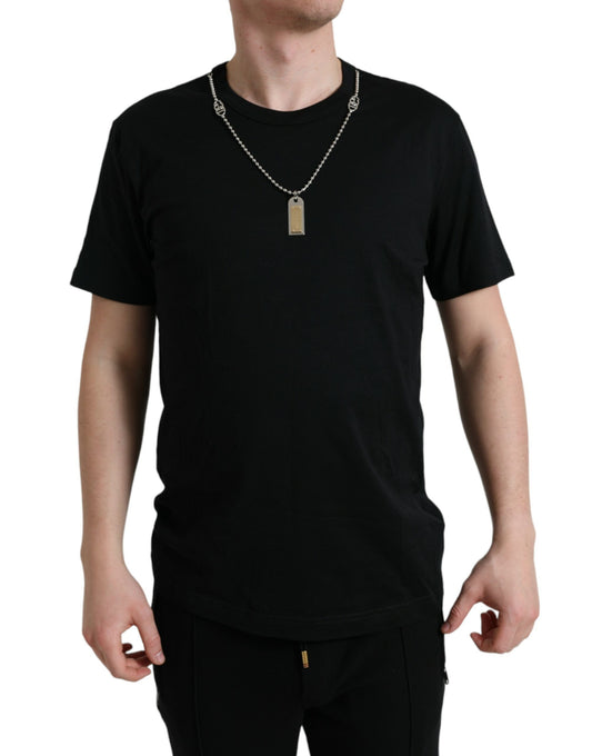 Man wearing black t-shirt and necklace
