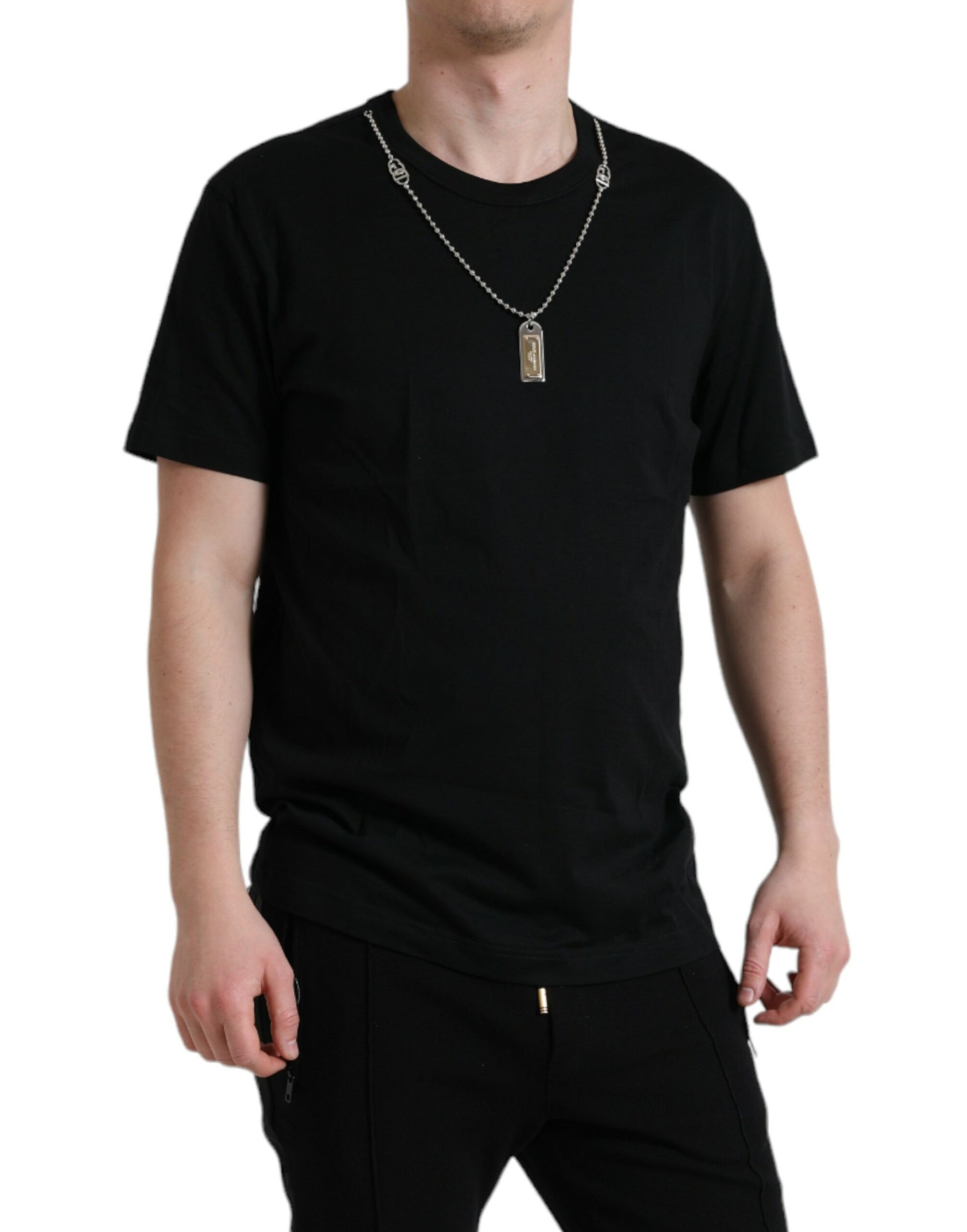 Man wearing black t-shirt and necklace