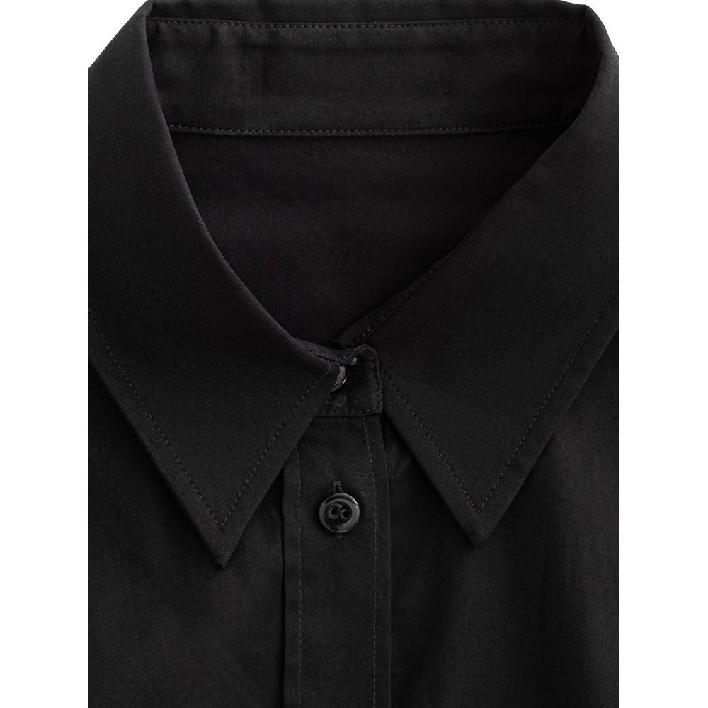 A black cotton dress shirt with a collar, buttoned front, and two chest pockets