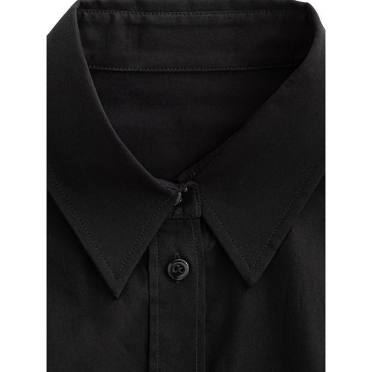 A black cotton dress shirt with a collar, buttoned front, and two chest pockets
