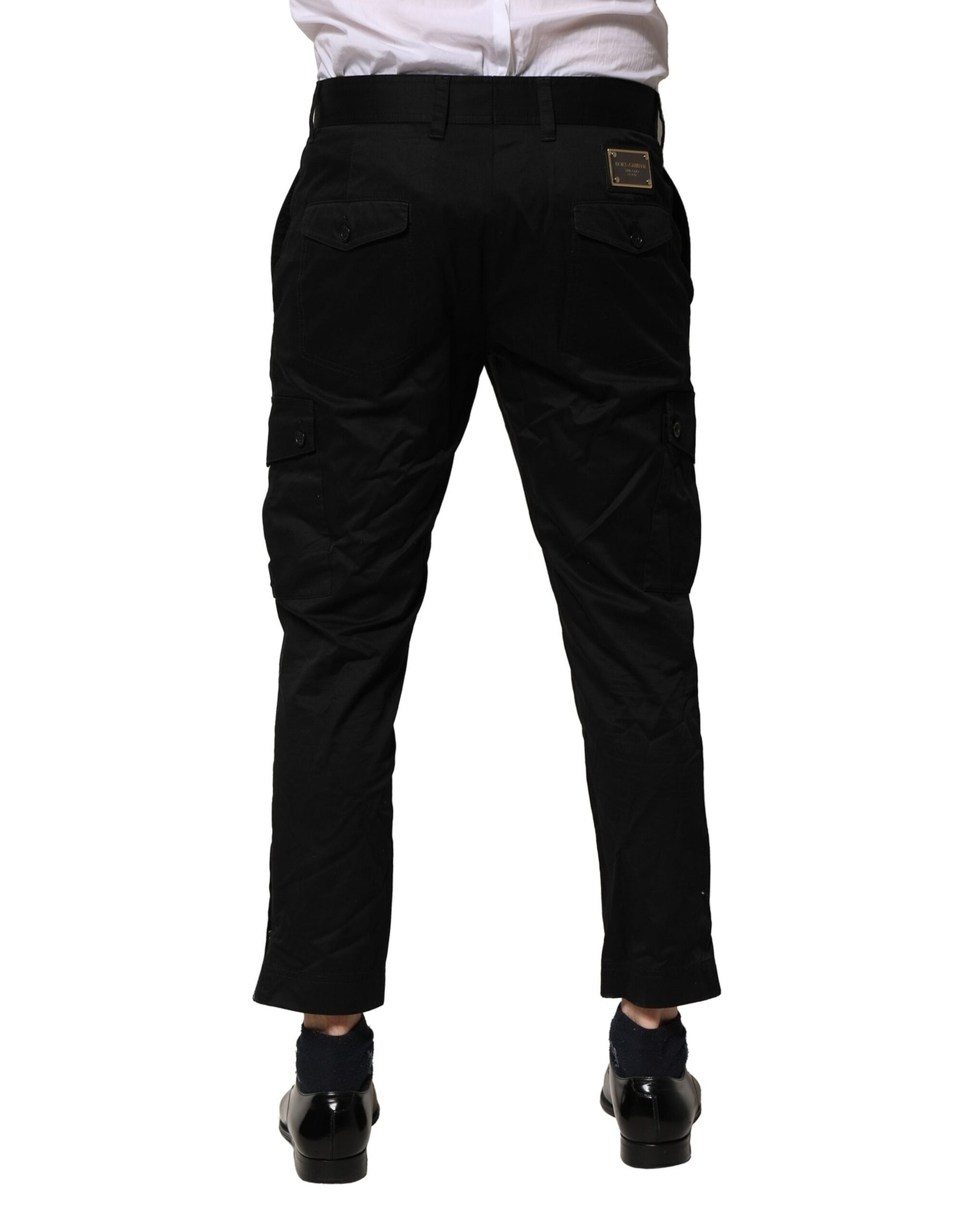 A pair of black cotton dress pants from Dolce & Gabbana, featuring a slim fit and formal design