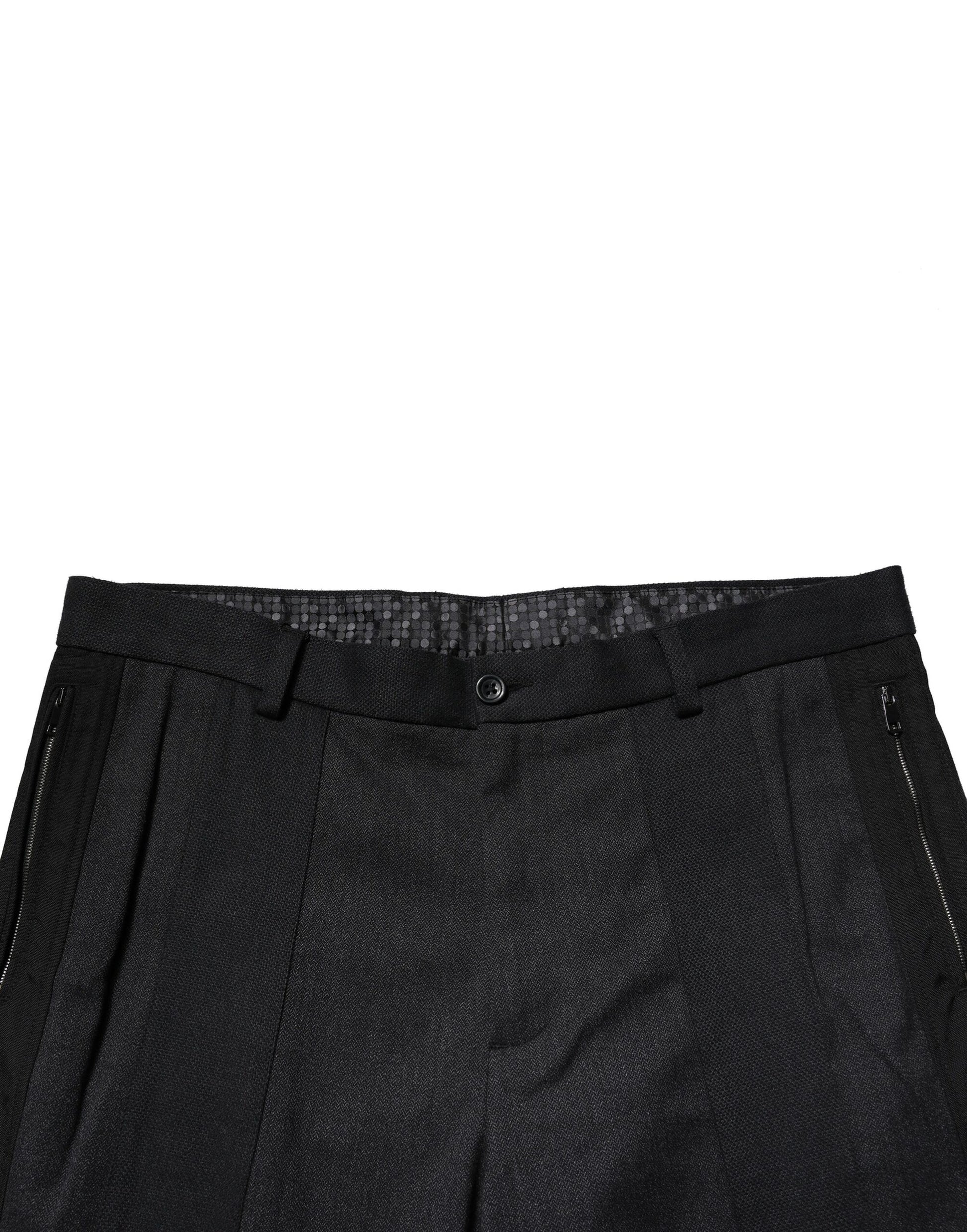 A pair of black cotton dress pants from Dolce & Gabbana, featuring a slim fit and formal design