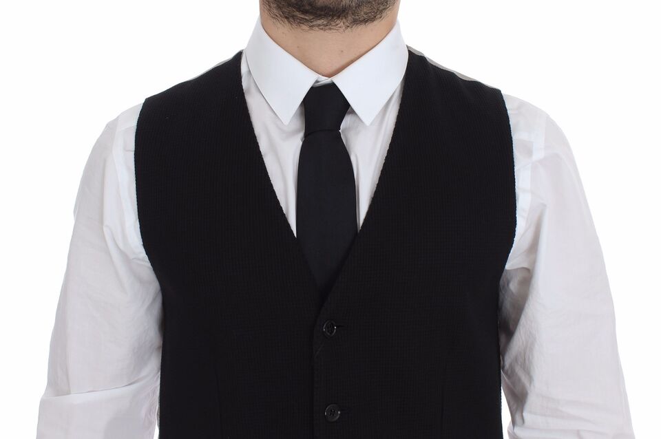 A black cotton vest jacket with a striped pattern, part of a formal suit
