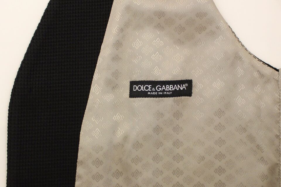 A black cotton vest from Dolce & Gabbana, featuring a distinctive pattern and the brand's logo