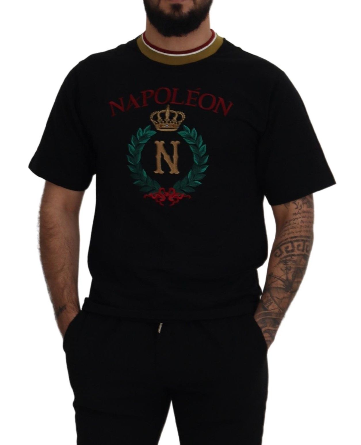Man wearing black t-shirt with red lettering and emblems
