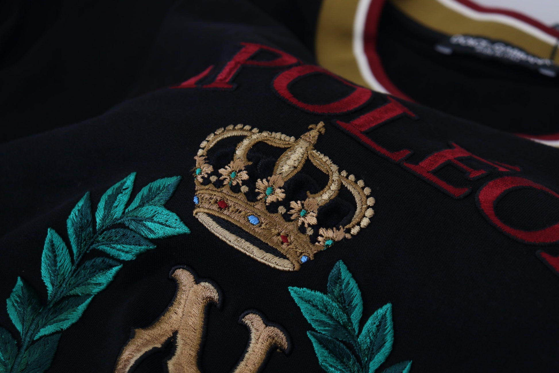Black jacket with embroidered crown and laurel leaves