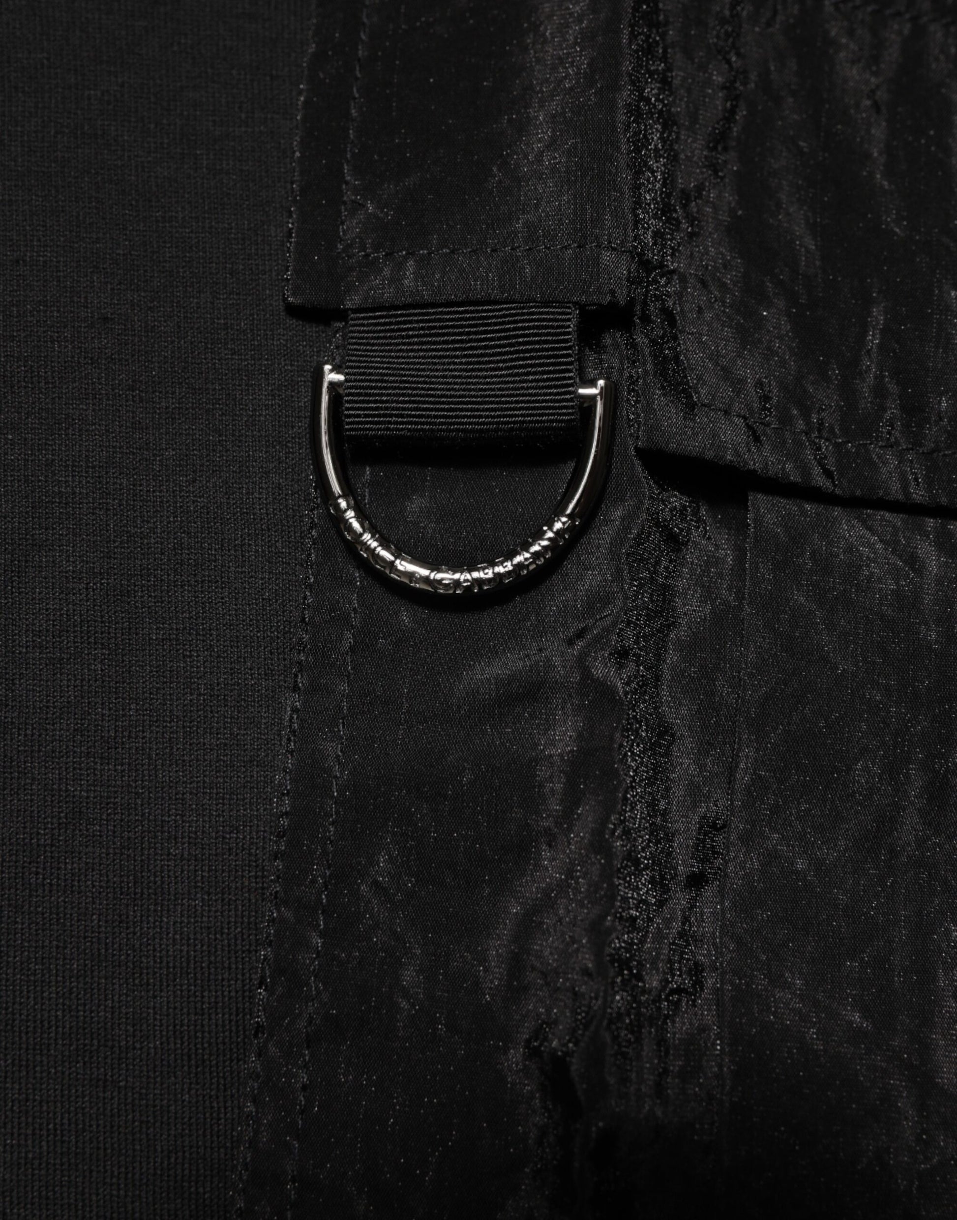 Silver ring on black fabric