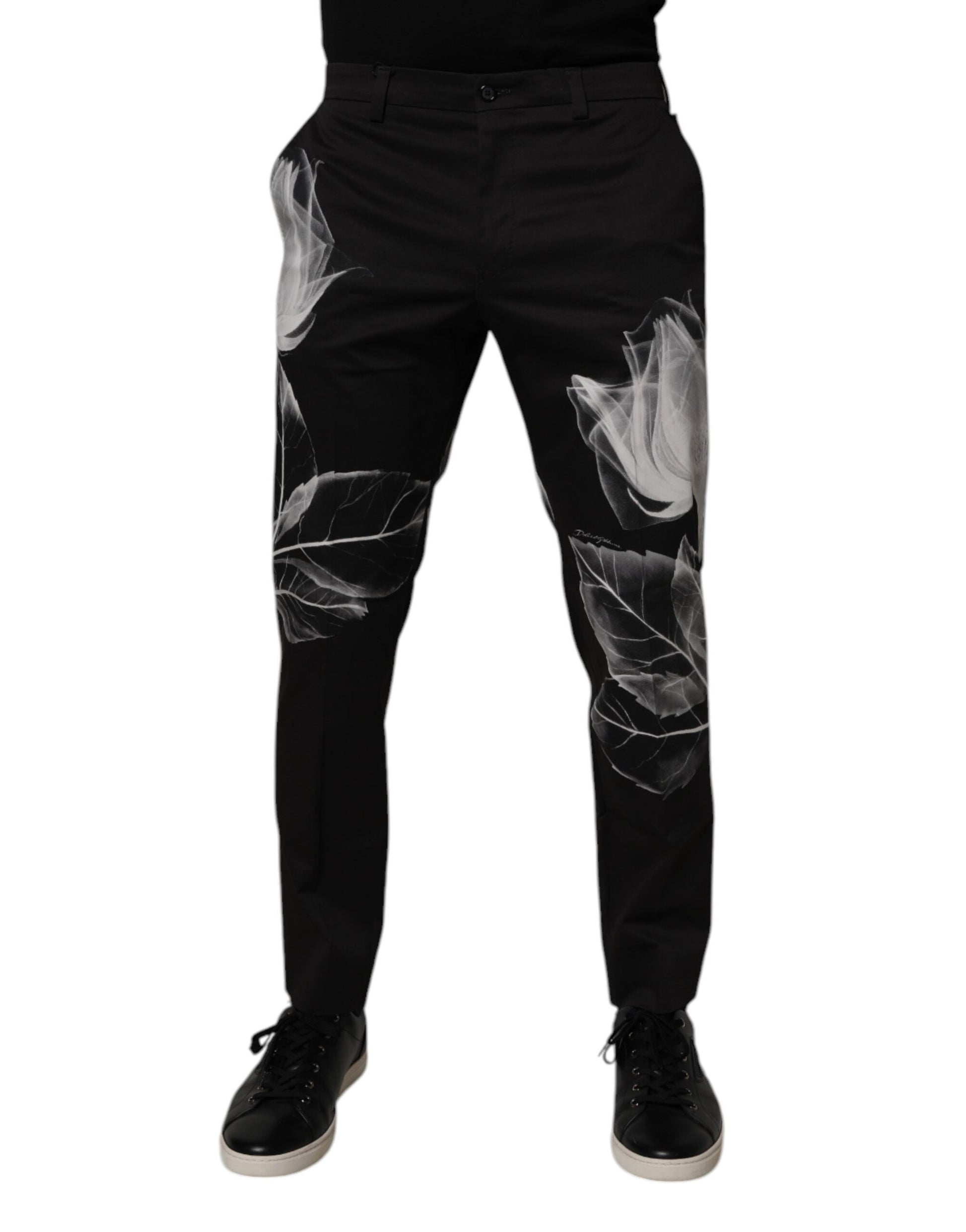 A pair of black cotton skinny dress pants with a floral print