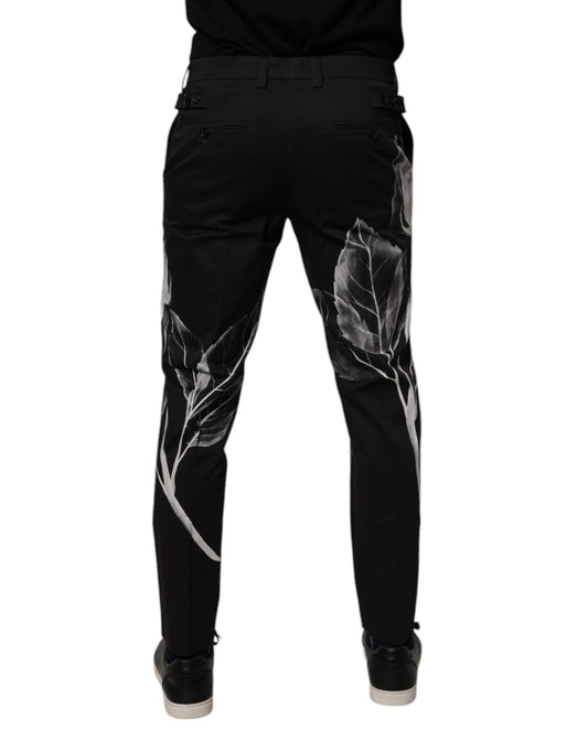 A pair of black cotton skinny dress pants with a floral print