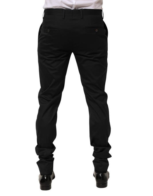 A pair of black cotton formal dress men's trousers with a slim fit