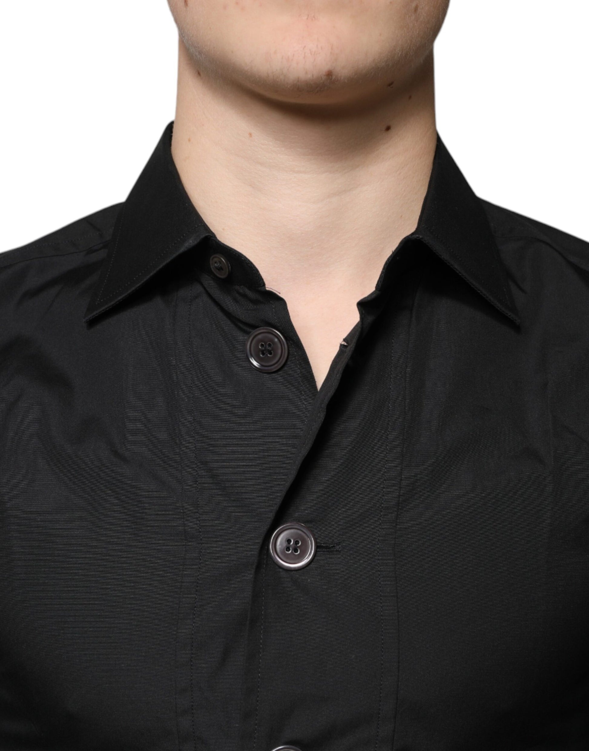 A black cotton formal long sleeve dress shirt with two visible buttons