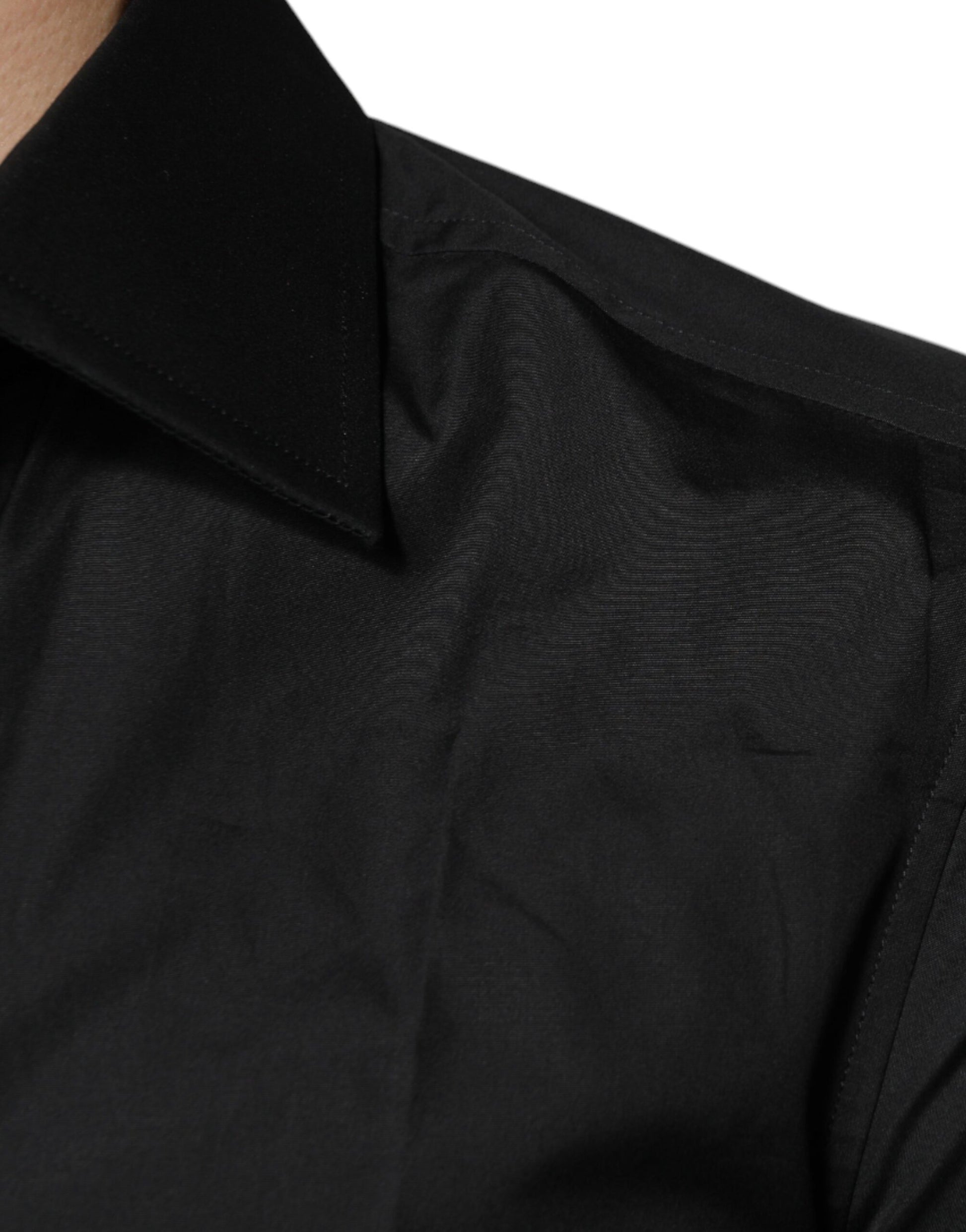 A black cotton dress shirt with long sleeves, featuring a textured pattern on the collar and cuffs