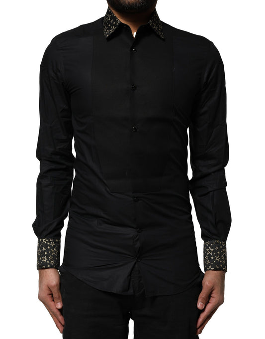 A black cotton dress shirt with gold accents on the sleeves