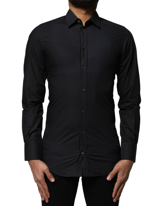 A black cotton dress shirt with long sleeves and gold accents