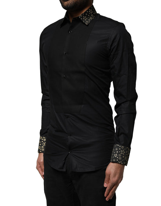A black cotton dress shirt with gold accents and long sleeves, designed by Dolce & Gabbana