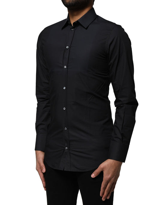 A black cotton dress shirt with long sleeves and gold accents
