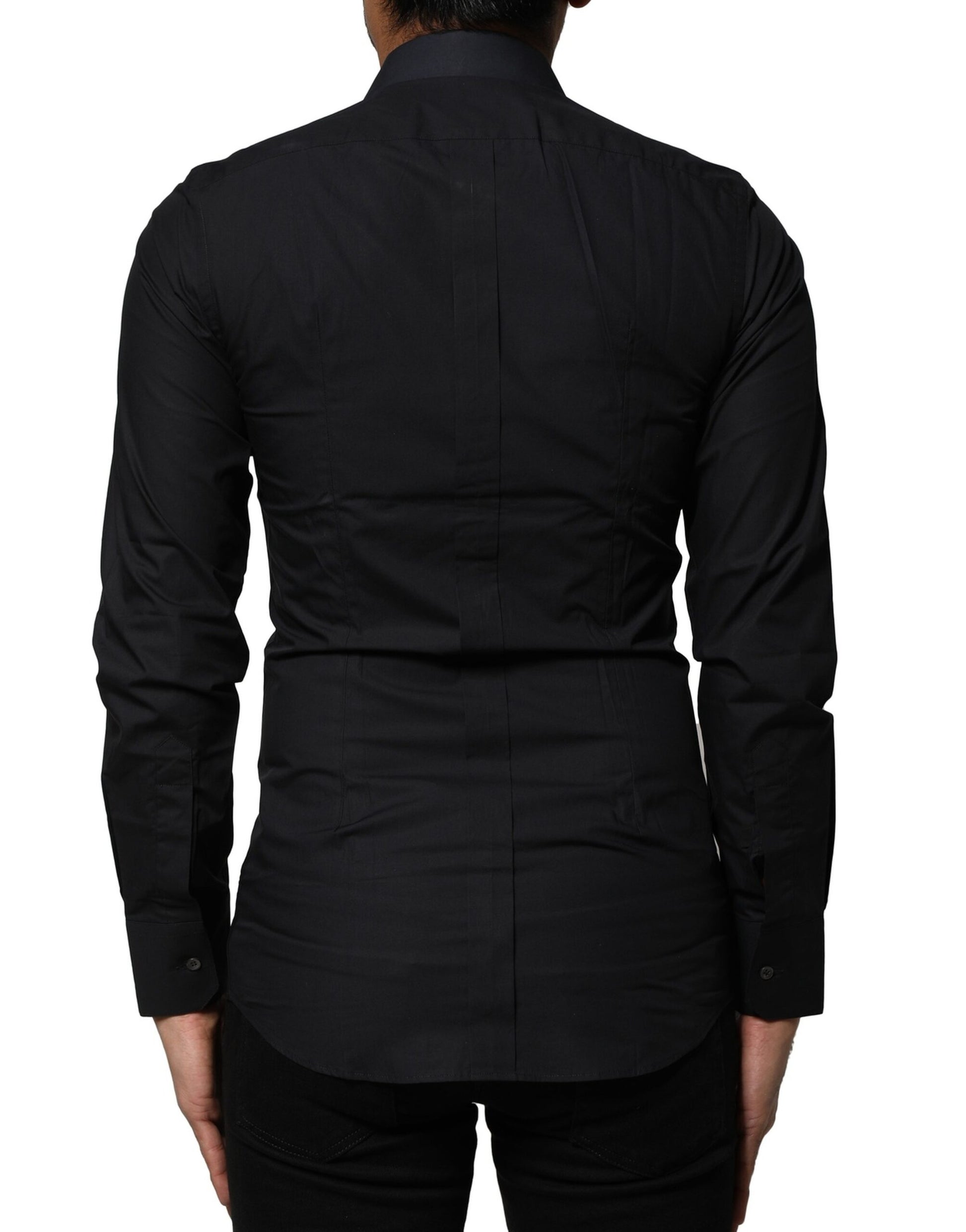 A black cotton dress shirt with long sleeves and gold accents