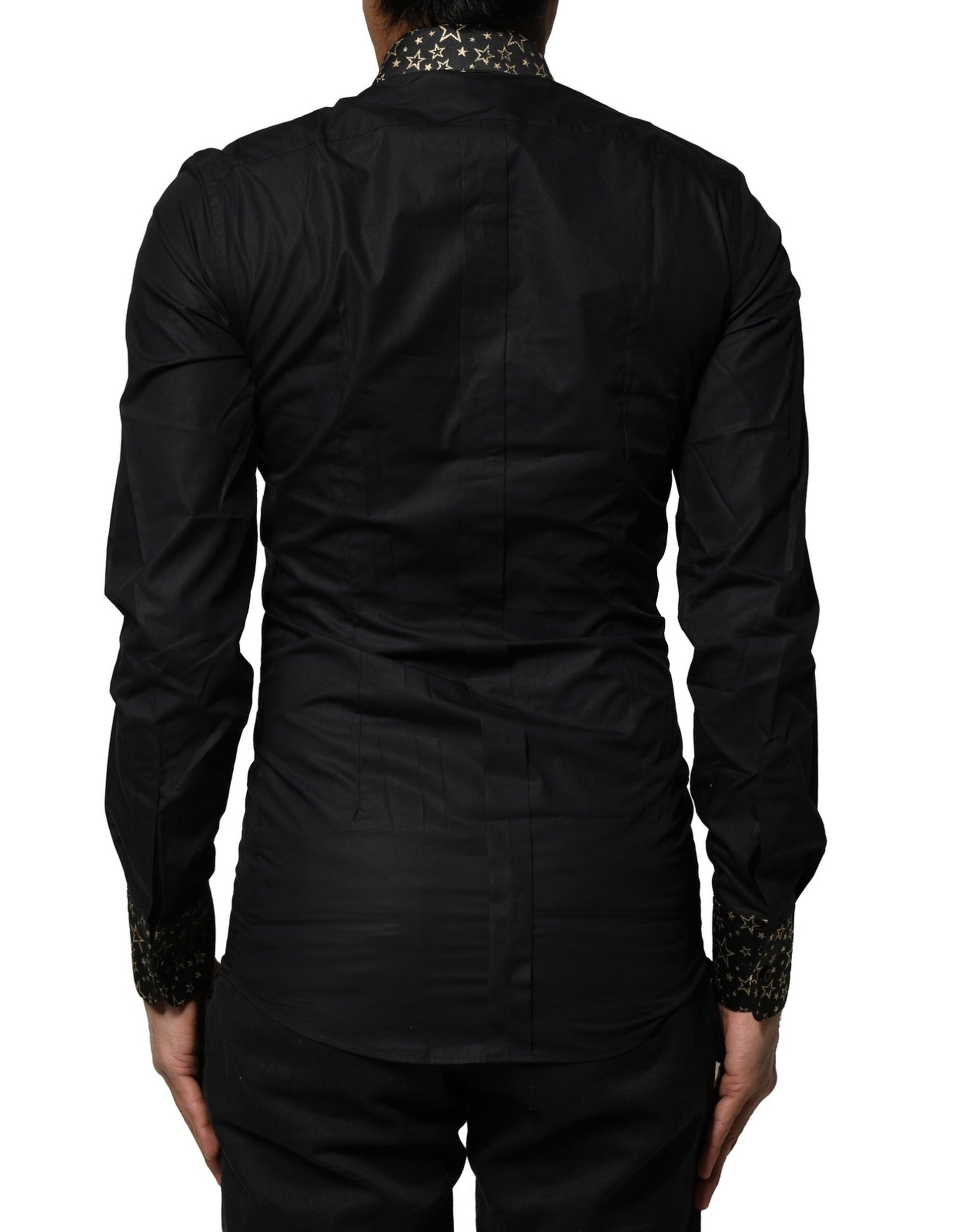 A black cotton dress shirt with long sleeves and gold accents
