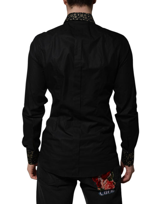 A black cotton dress shirt with long sleeves and gold accents