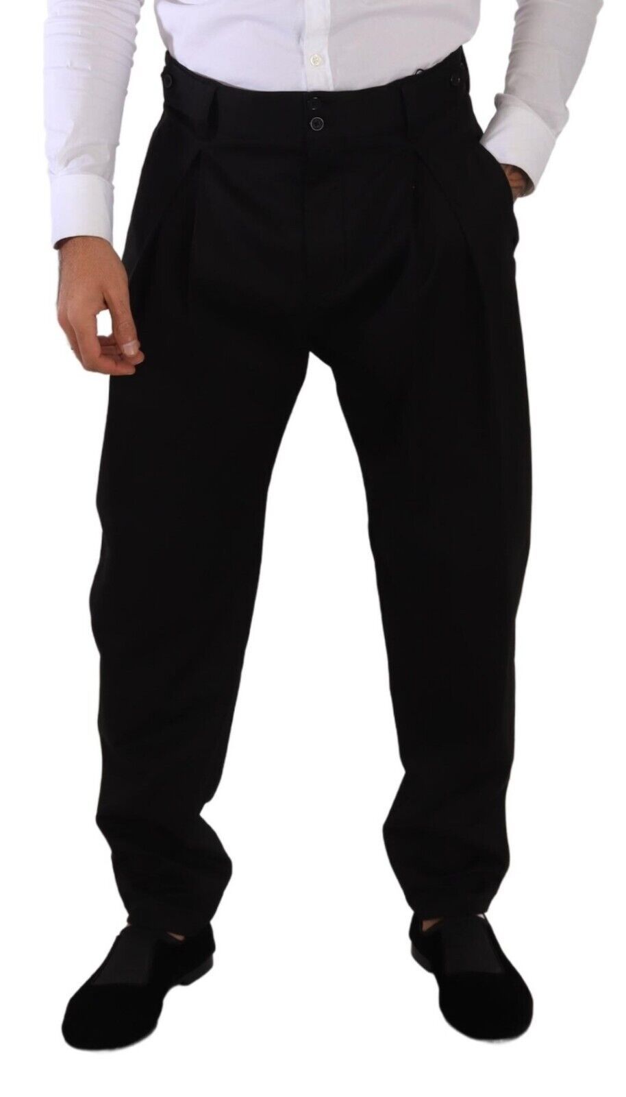 Man wearing black suit pants and shoes
