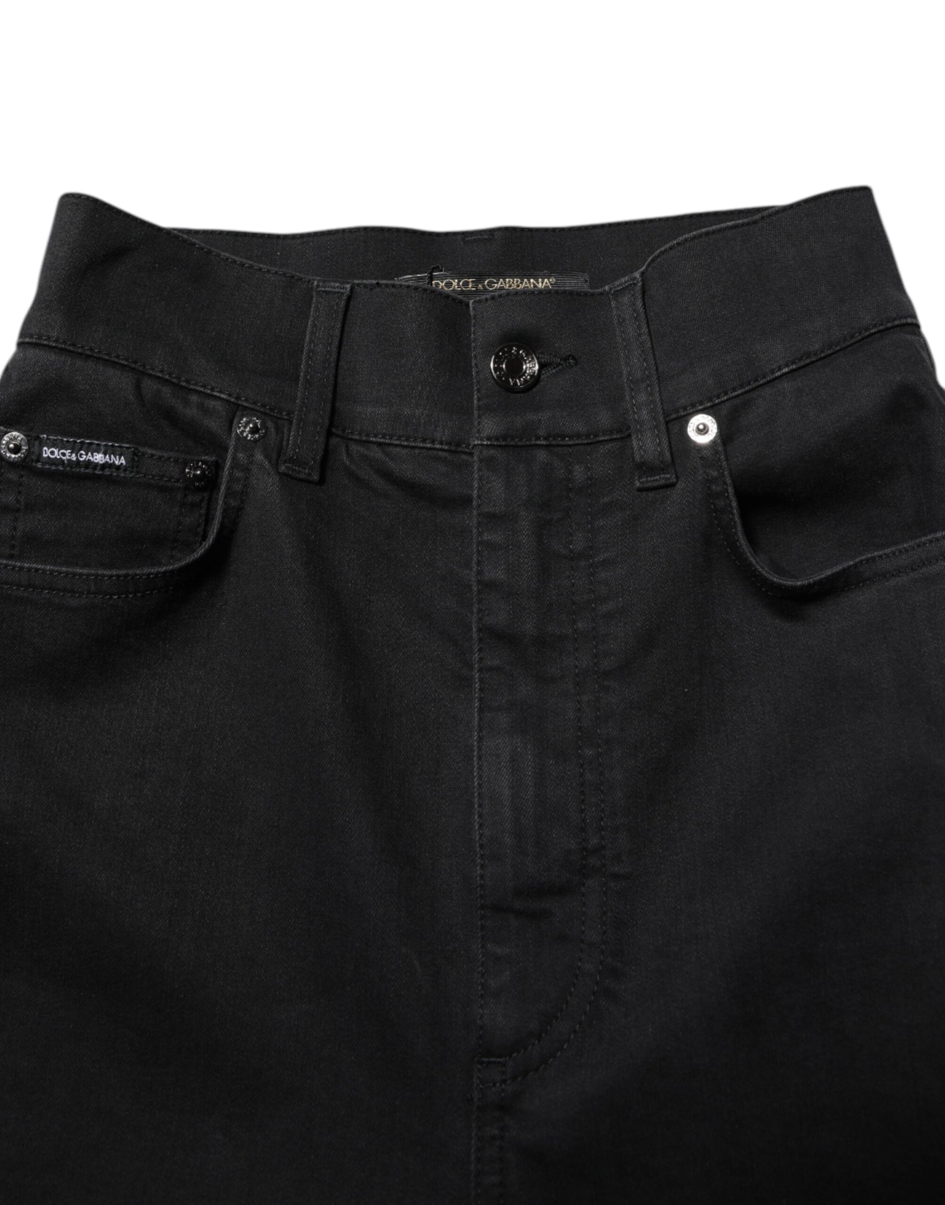 Pair of dark blue jeans with visible stitching details on front