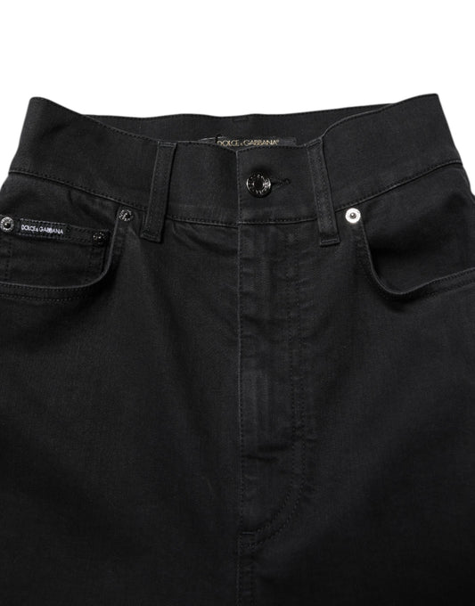 Pair of dark blue jeans with visible stitching details on front