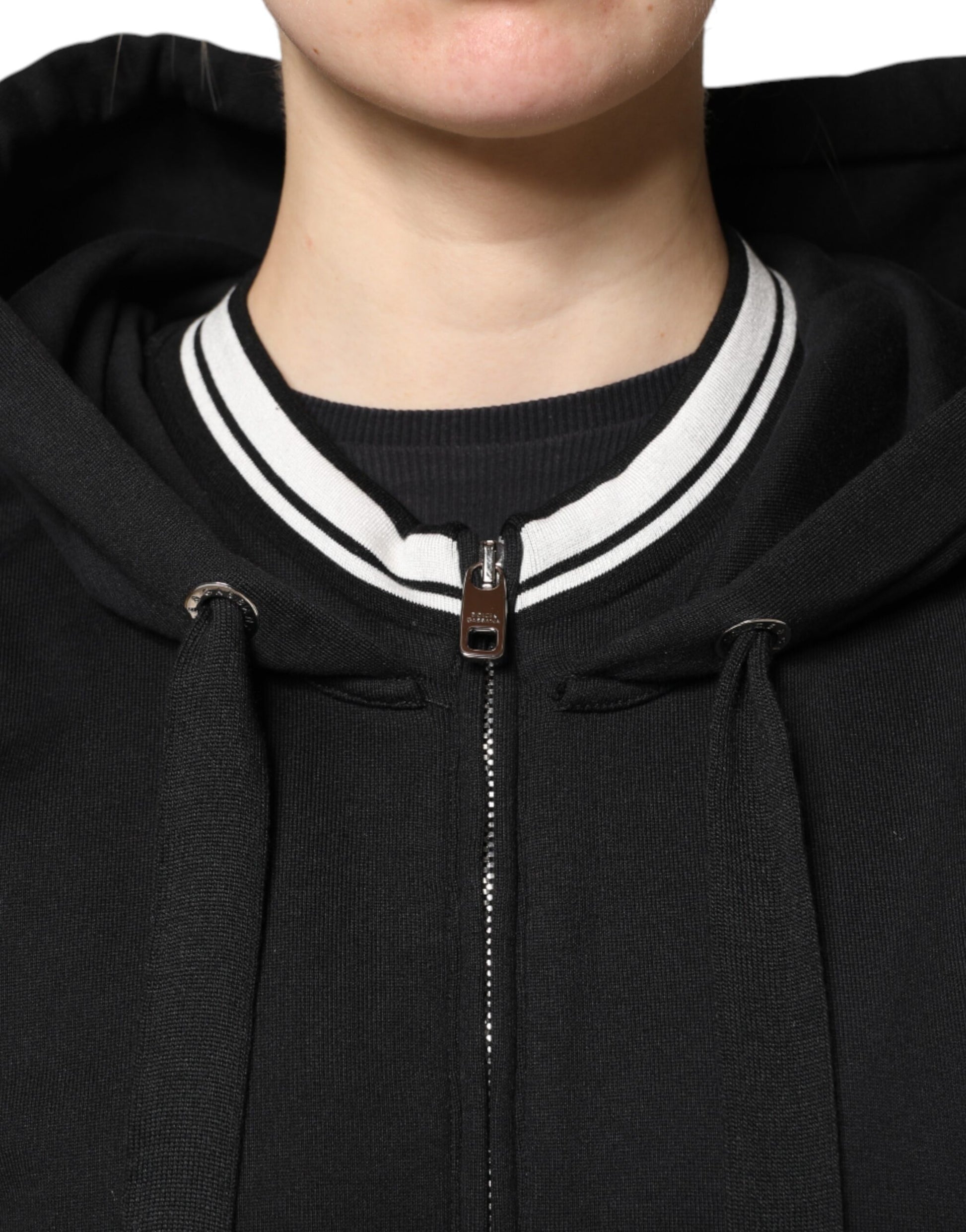 Black hoodie with white zipper and drawstrings