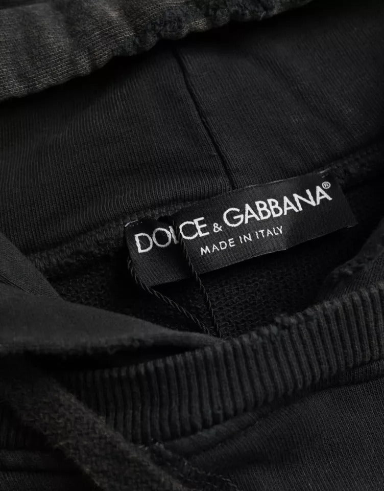 Black pants with a label that reads "Dolce & Gabbana Made in Italy"