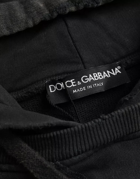 Black pants with a label that reads "Dolce & Gabbana Made in Italy"