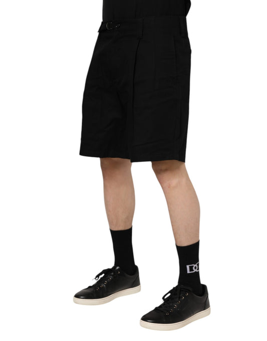 Man wearing black shorts and shoes