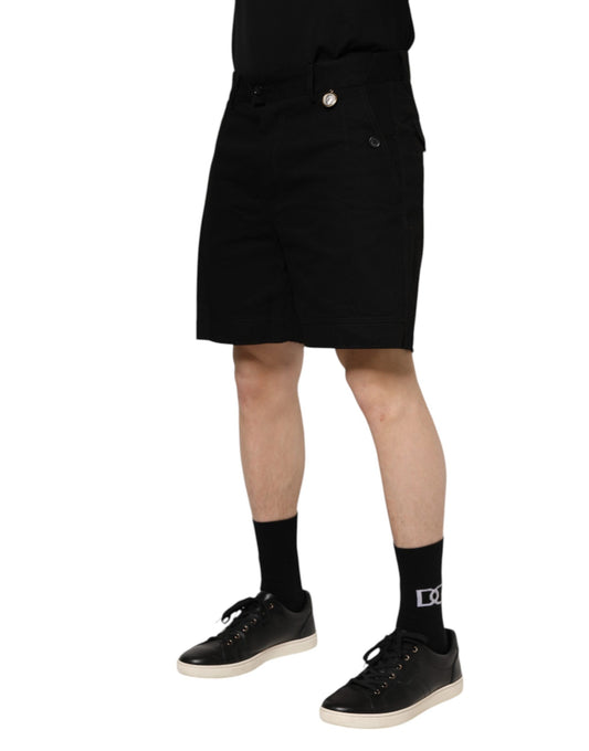 Man wearing black shorts and shoes