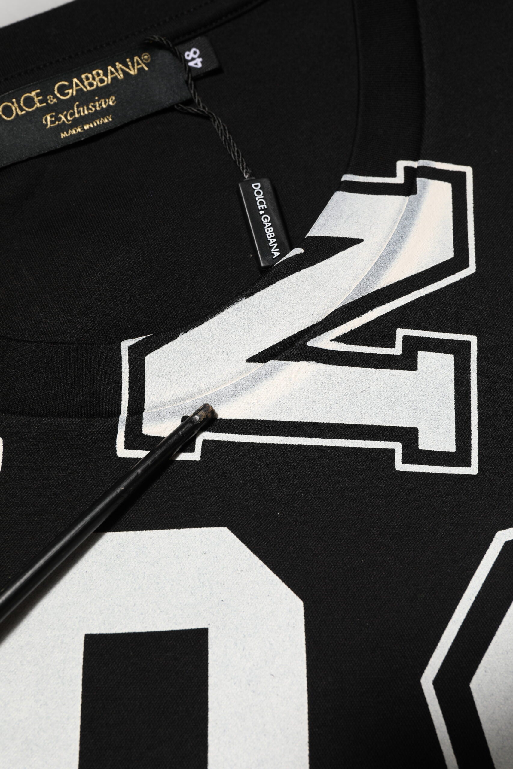 Black shirt with white lettering and number