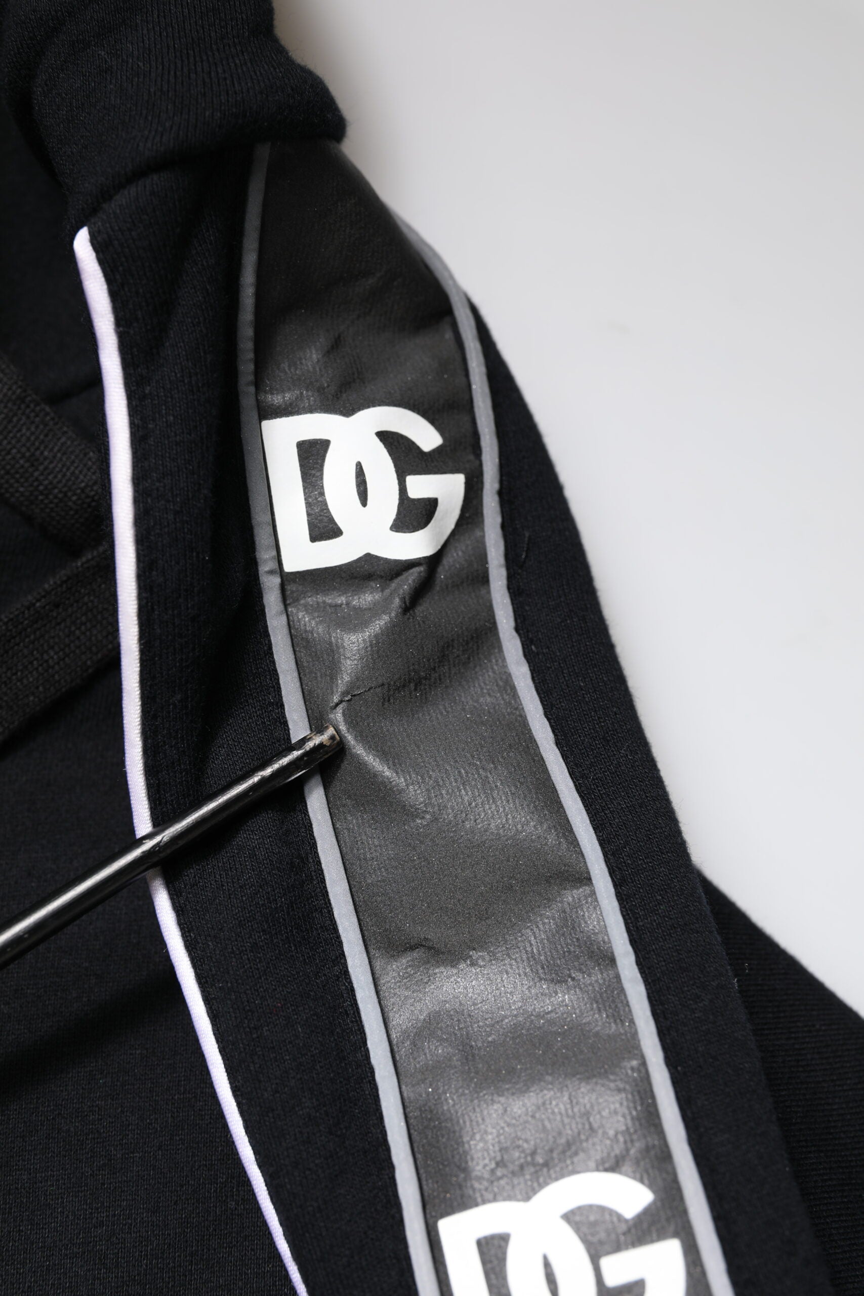 Black sweatpants with white stripe and DC logo