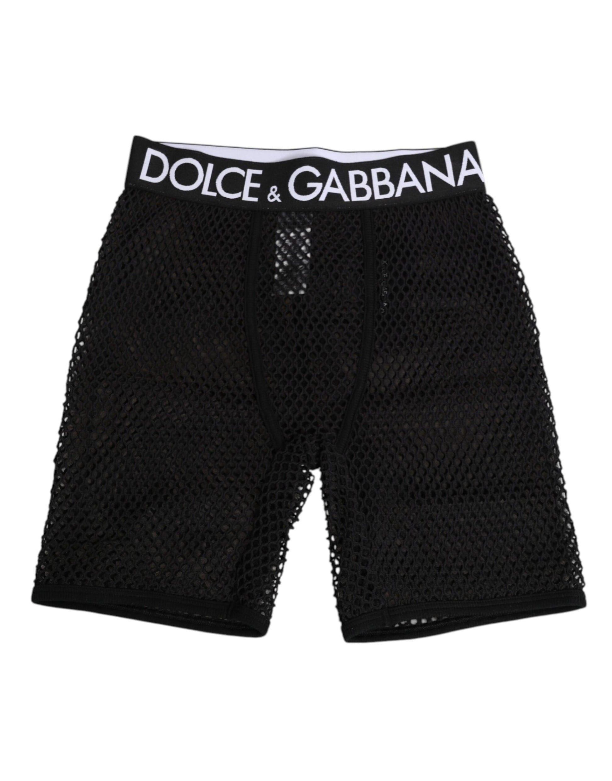 Black cotton logo shorts with midi trousers underneath