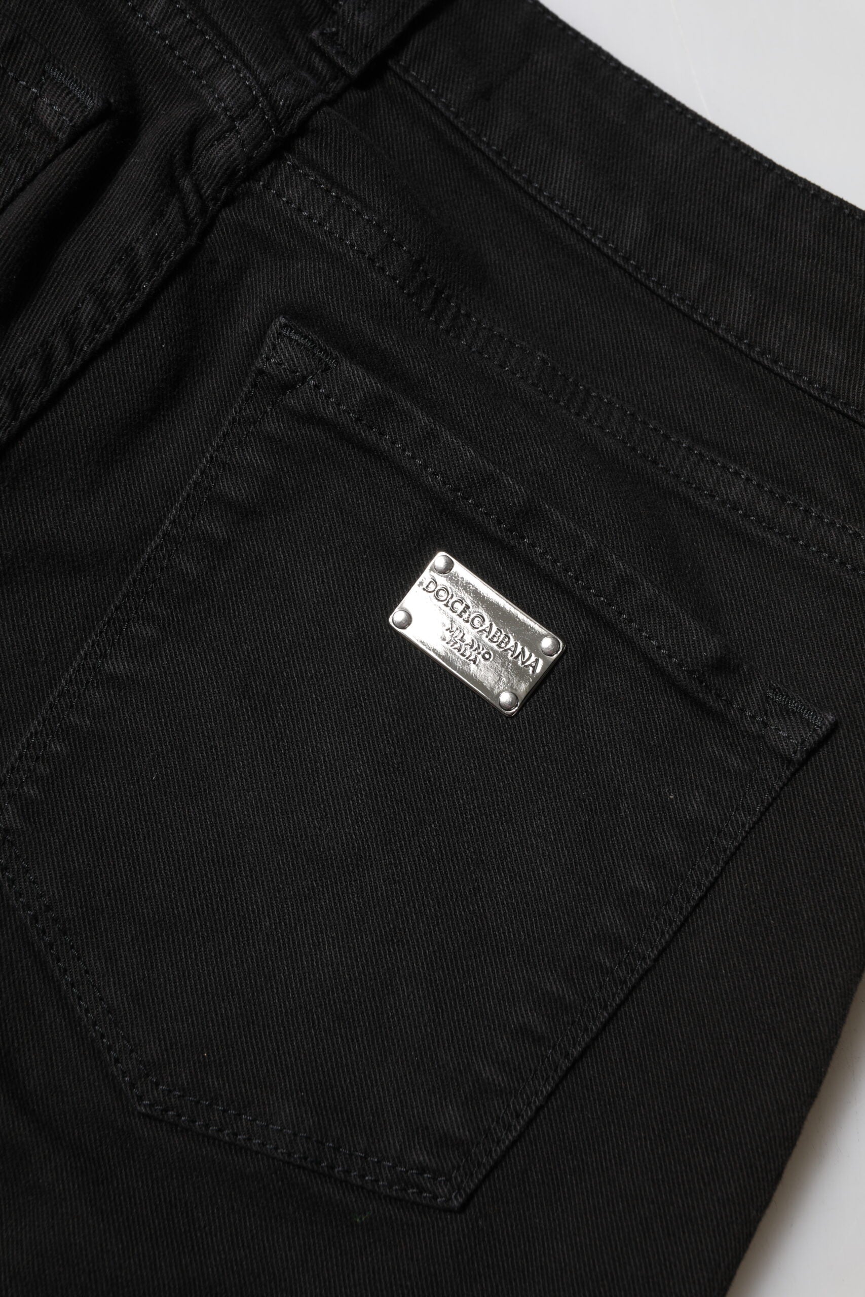 Black pants with silver logo on right side
