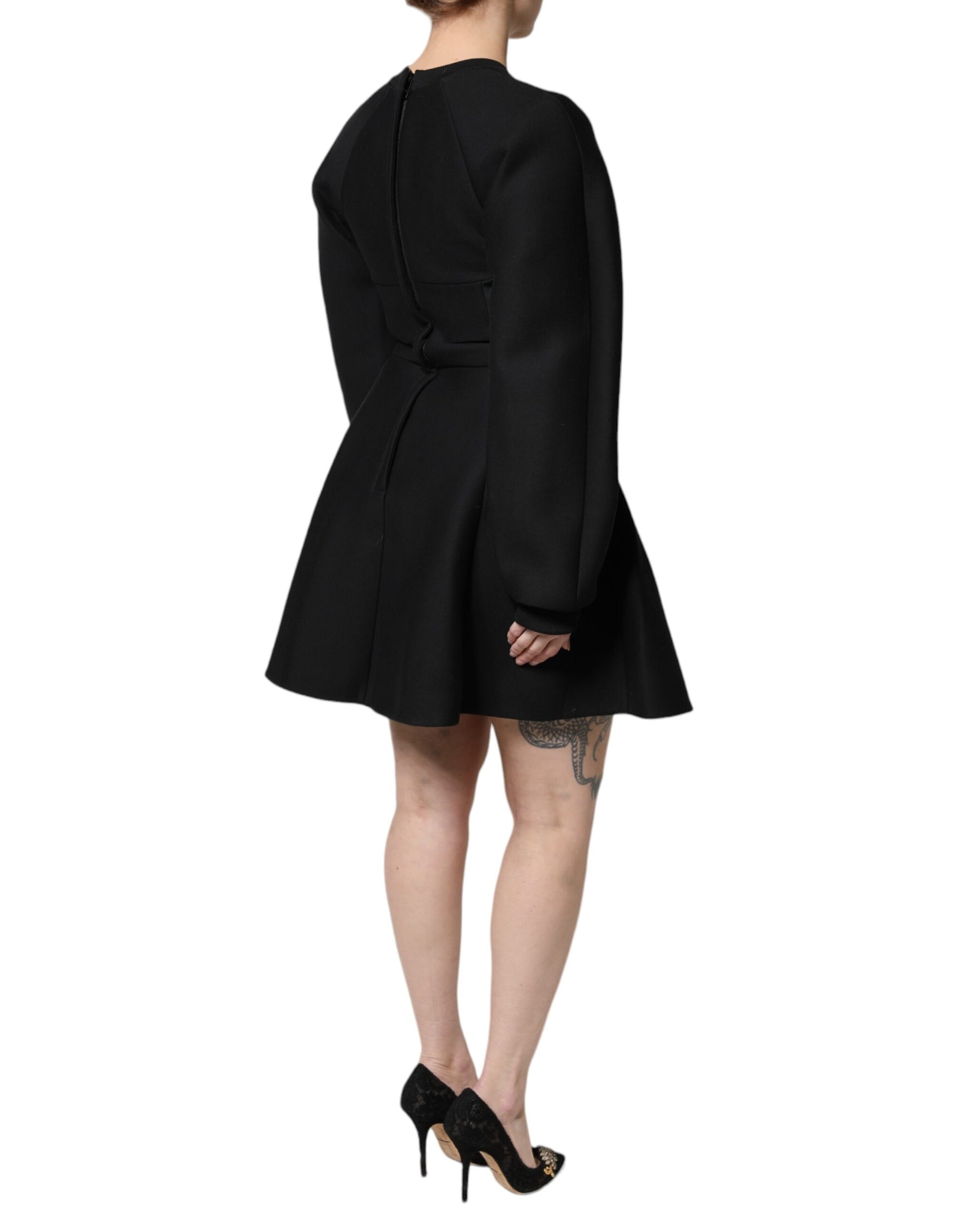 A black cotton long sleeve A-line mini dress