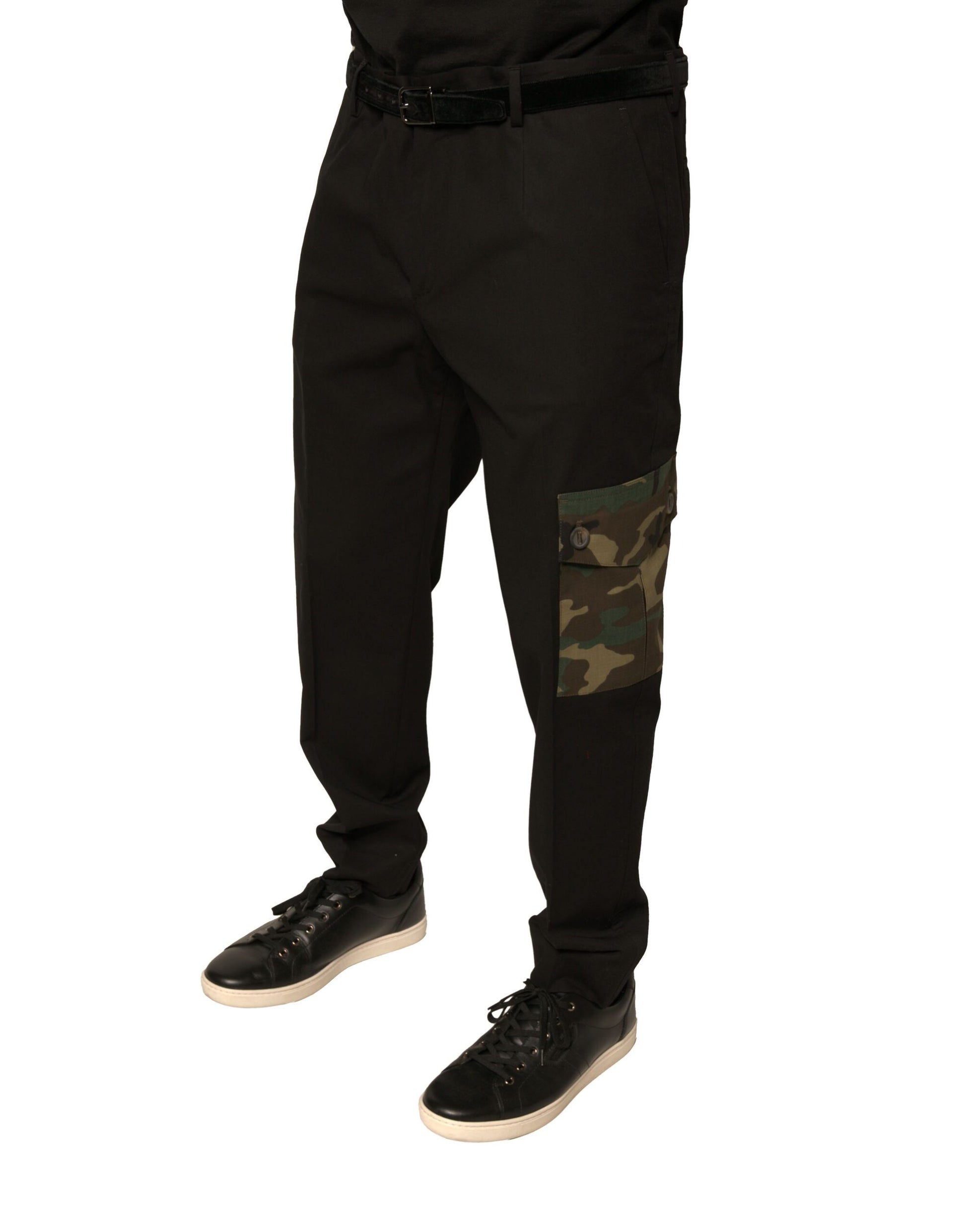 Man wearing black pants with camouflage pattern on left leg