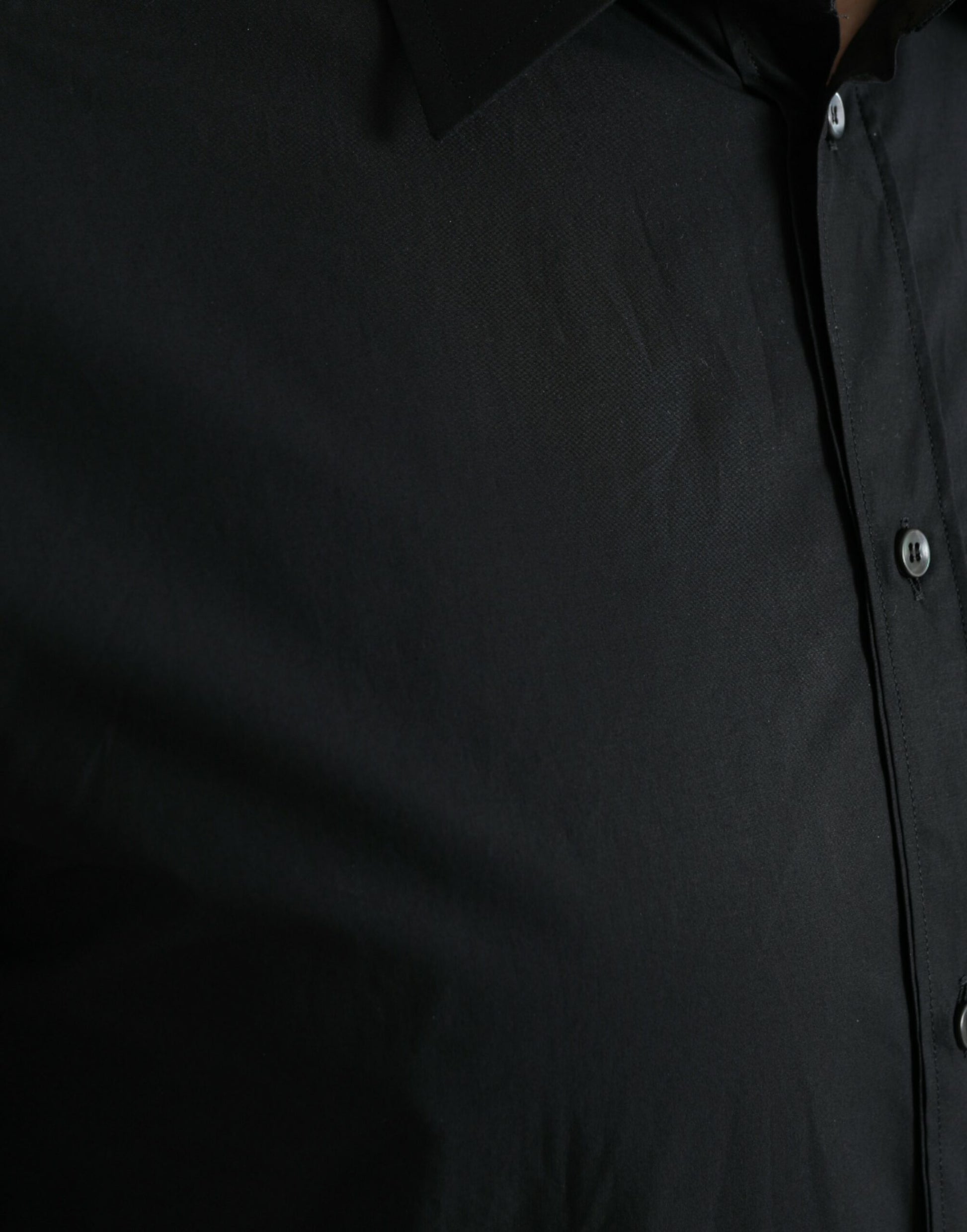 A black cotton men's formal dress shirt with a gold design