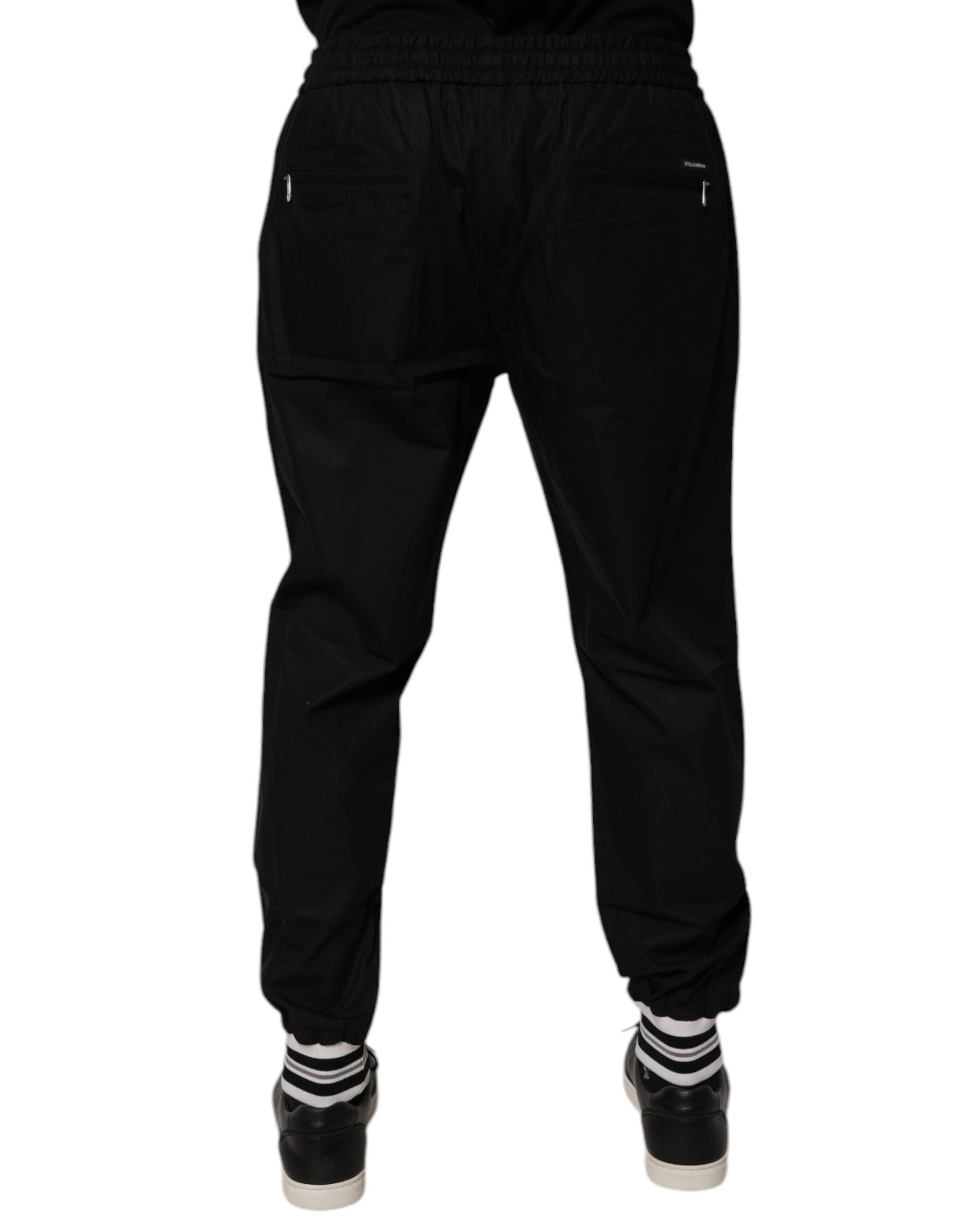 Pair of black pants with white stripes on sides